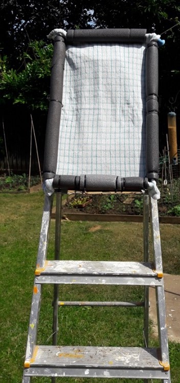 Step ladder with tea-towel.